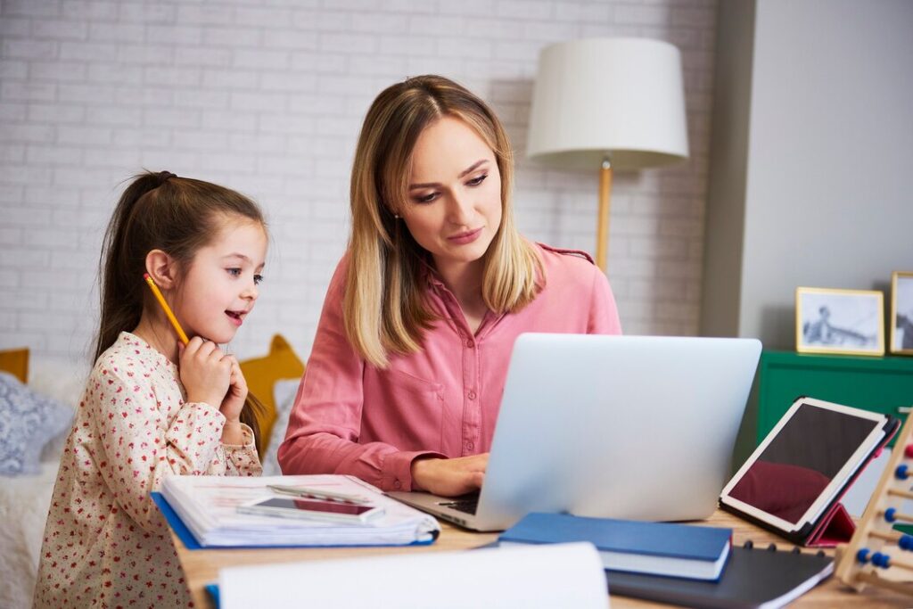 student learning with English tutors in London, focusing on grammar and writing skills.