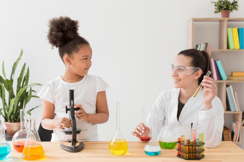 Primary school science tutor in London helping a young student with science