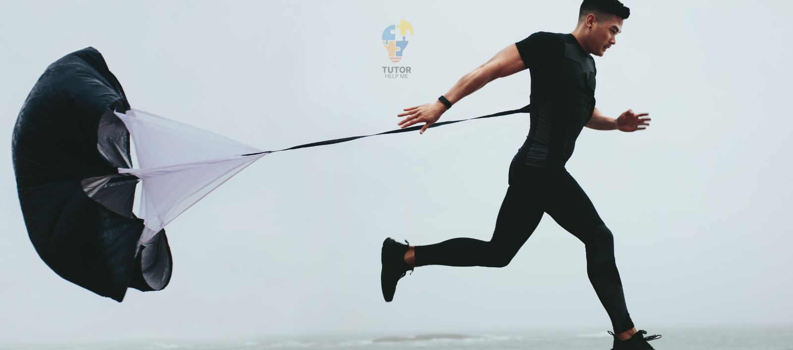A runner wearing sleek athletic gear pulls a parachute-like resistance device, showcasing intense training against a cloudy backdrop.