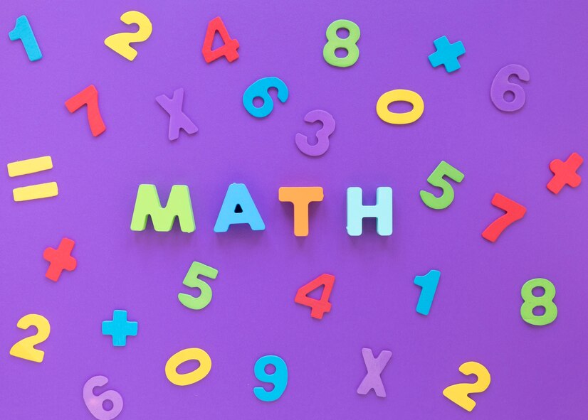 Colorful foam numbers and symbols arranged playfully around the word "MATH" in bold letters on a purple background.