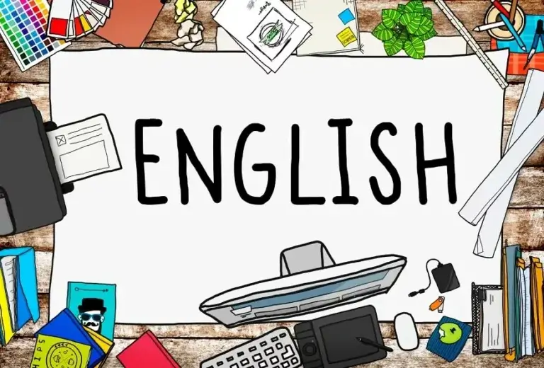 A creative workspace featuring various tools and papers surrounding the large word "ENGLISH" written on a white sheet.