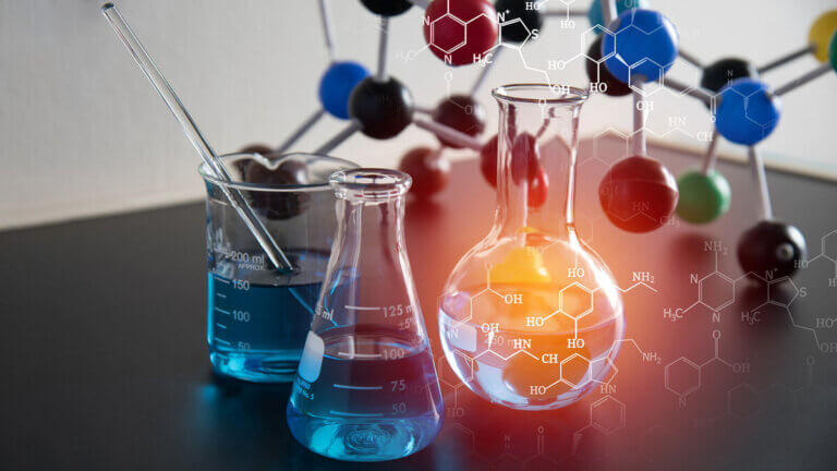 Laboratory scene with blue liquids in beakers and flasks, surrounded by molecular models and chemical structures.