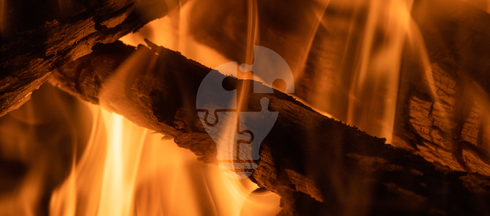 A close-up of glowing firewood with flames dancing around it, featuring a subtle light bulb graphic in the center.