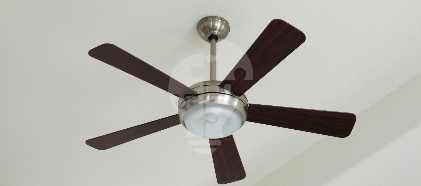 A modern ceiling fan with five dark wooden blades and a frosted glass light fixture, mounted on a sleek metallic base.