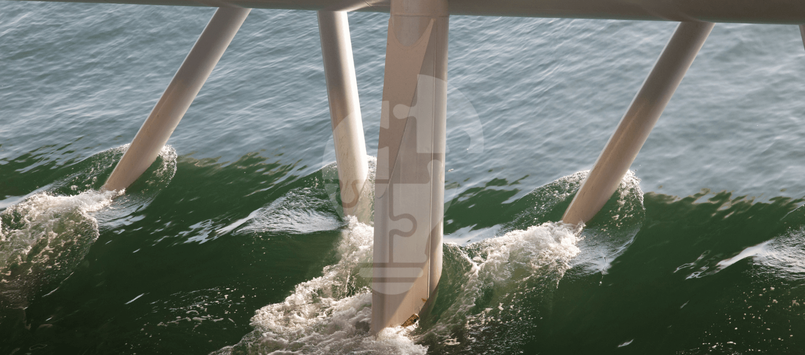 Pillars emerging from waves, supporting a structure above, create a dynamic interplay between water and architecture.